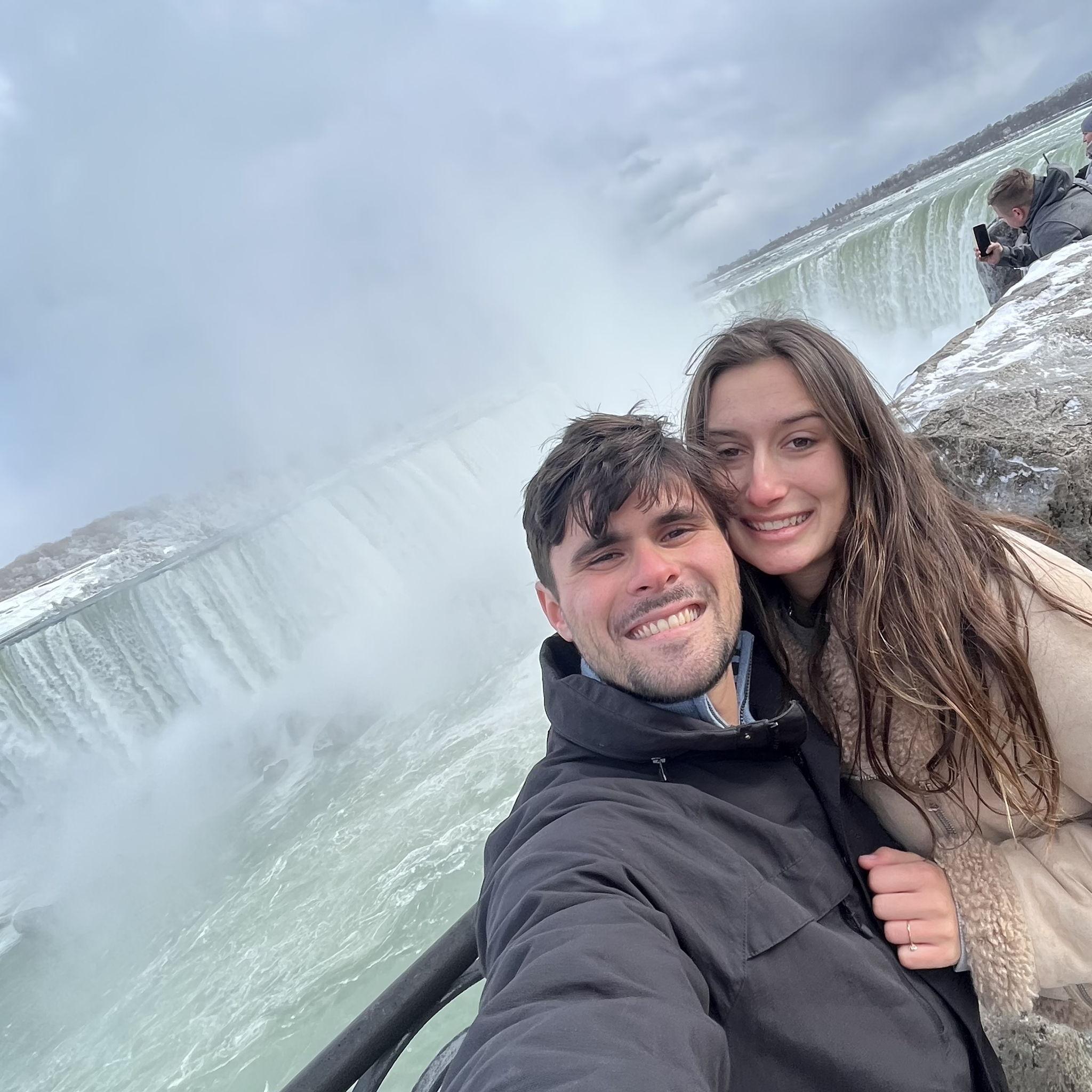 James and Charlotte shivering in front of Niagara Falls (they forgot gloves on this trip and spent $40 at the official store)