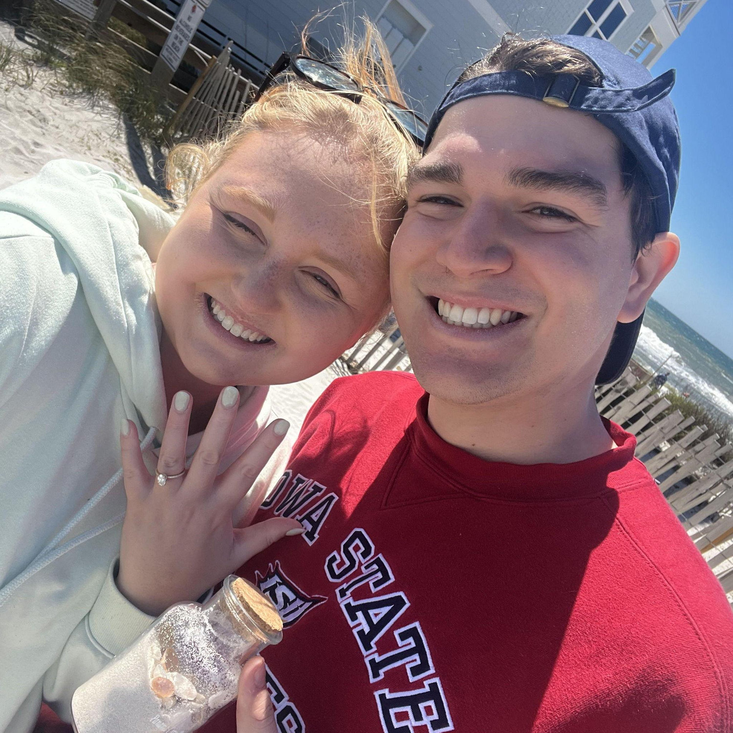 Collecting sand from the trip he proposed!