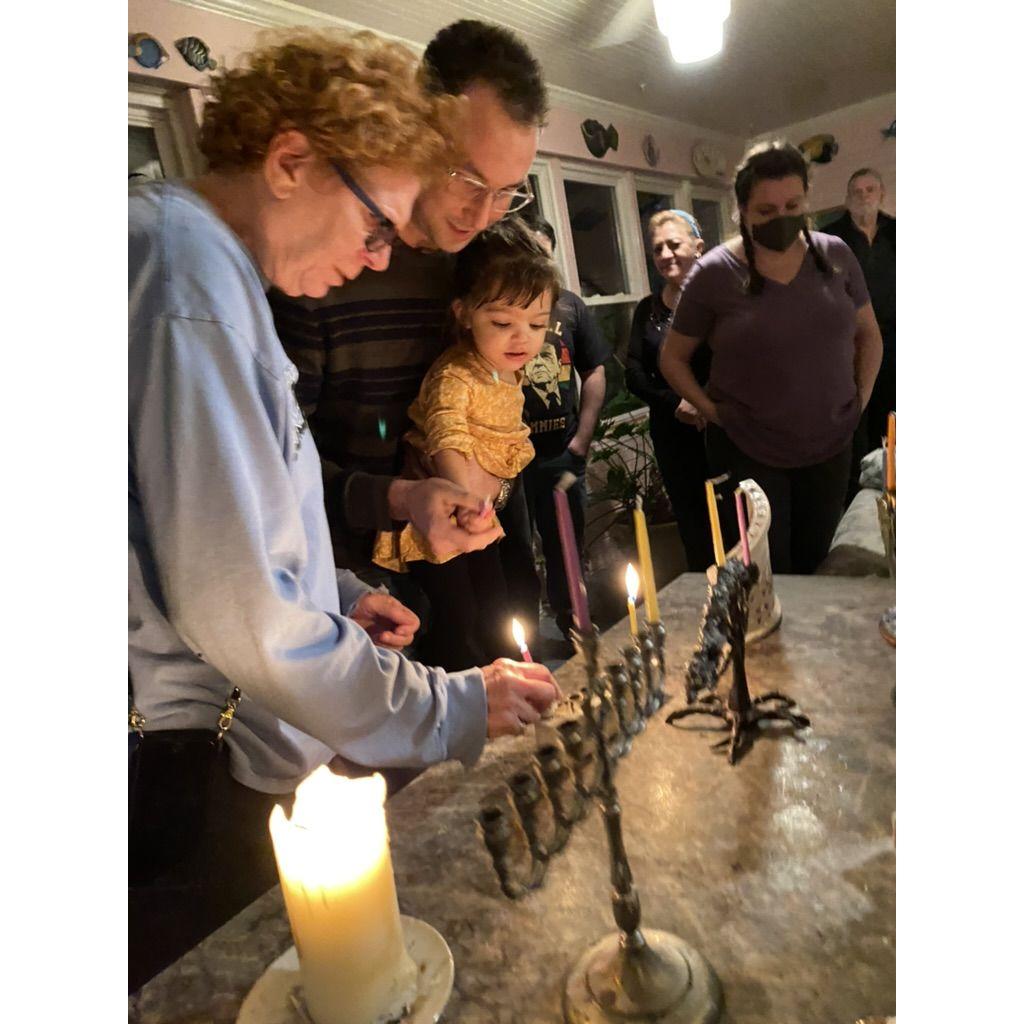 A special Hanukkah memory with Nathan’s mom, Susan, and cousin Luna—lighting candles, and celebrating together.
