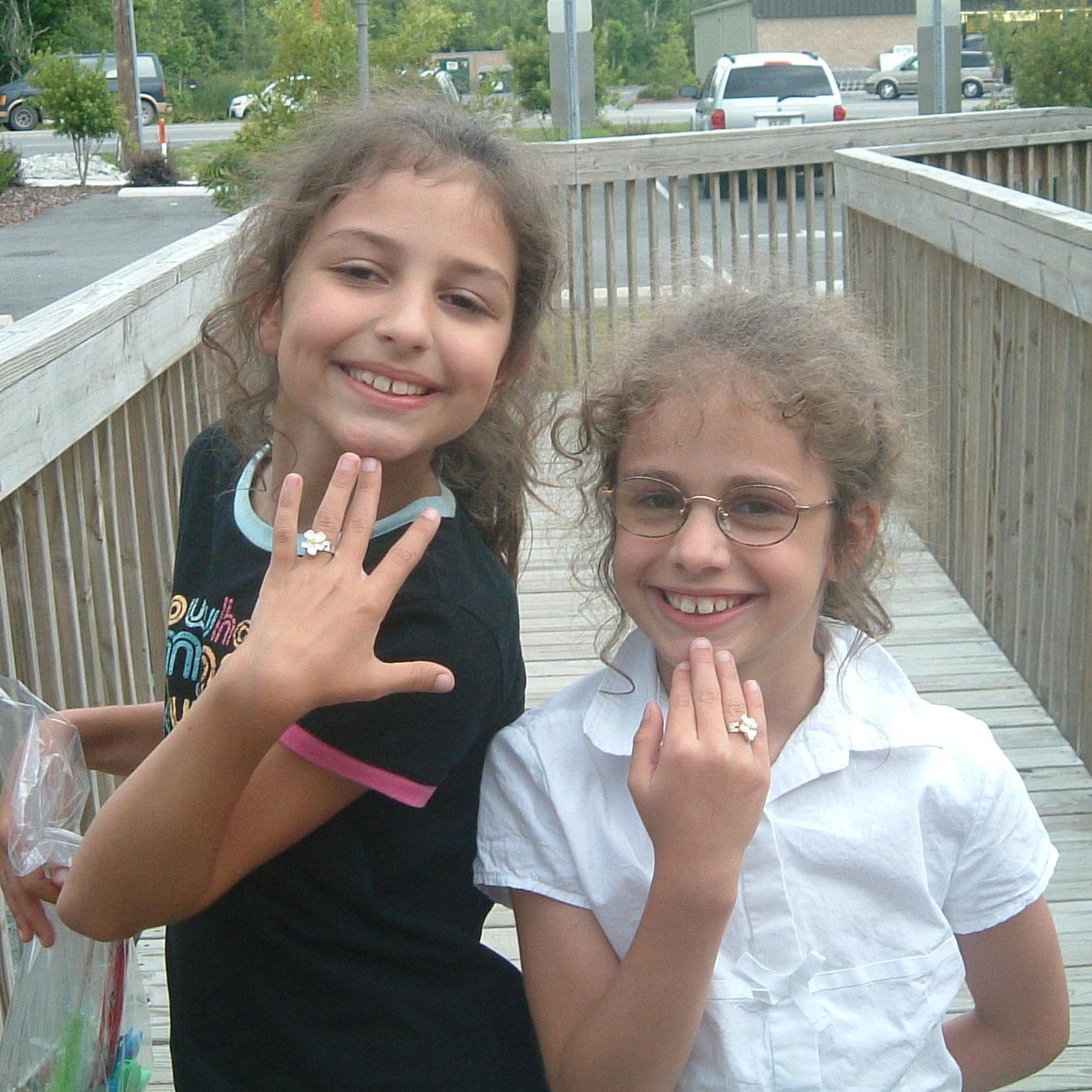 Justice + Grace showing off their prizes from the arcade