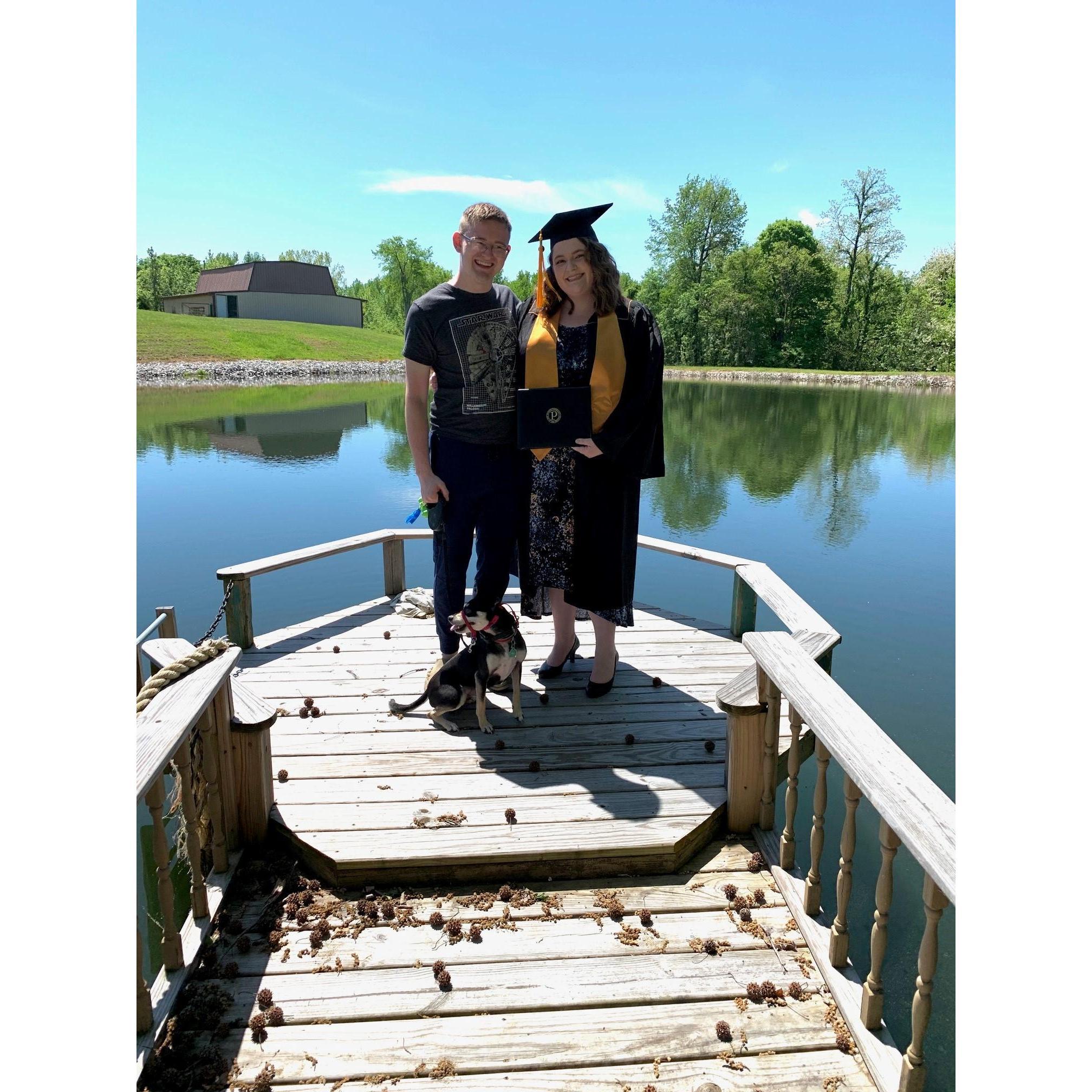 Lexi graduating from Quarantine with Mitchell and our dog Loki.