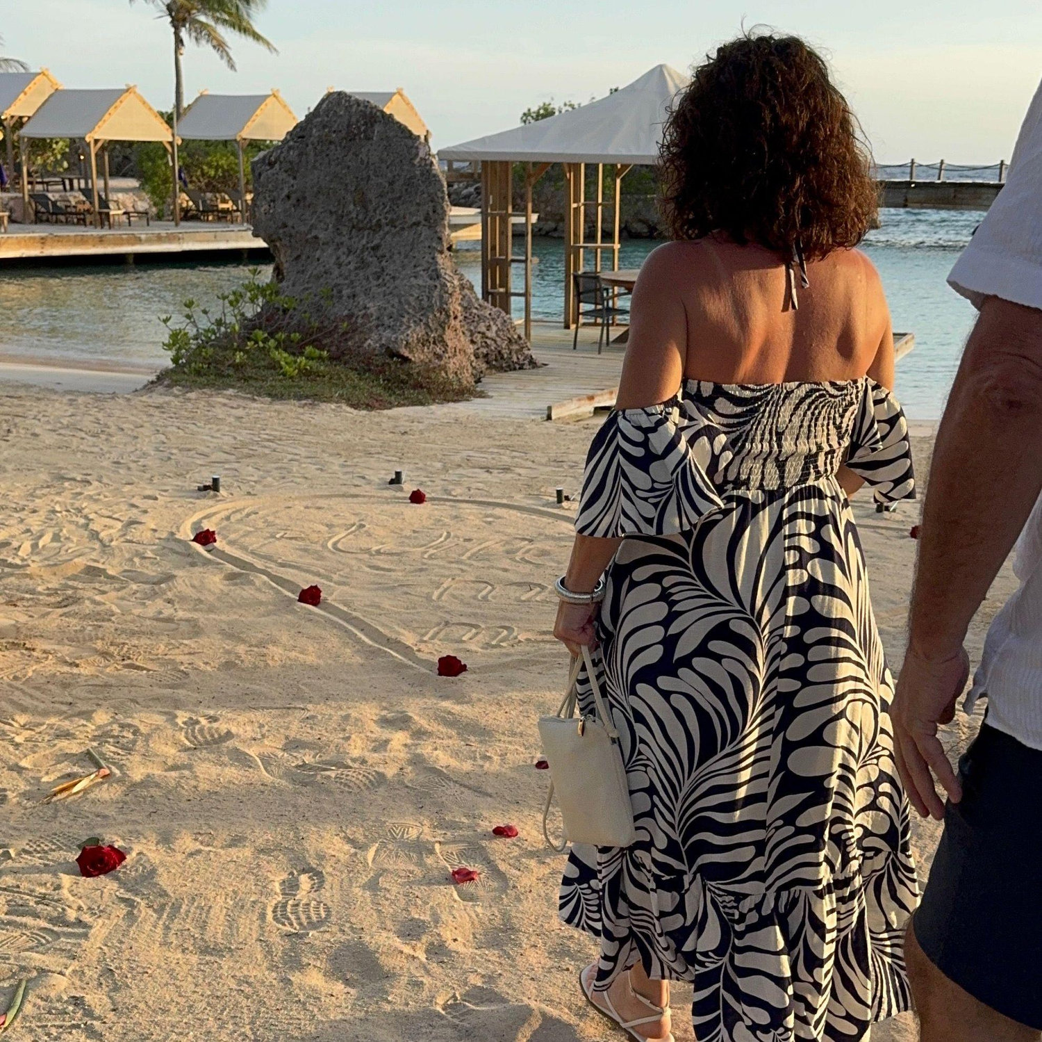 The sunset was absolutely beautiful---I thought we were walking to the perfect spot to snap a photo. Not realizing the rose petals were for me.