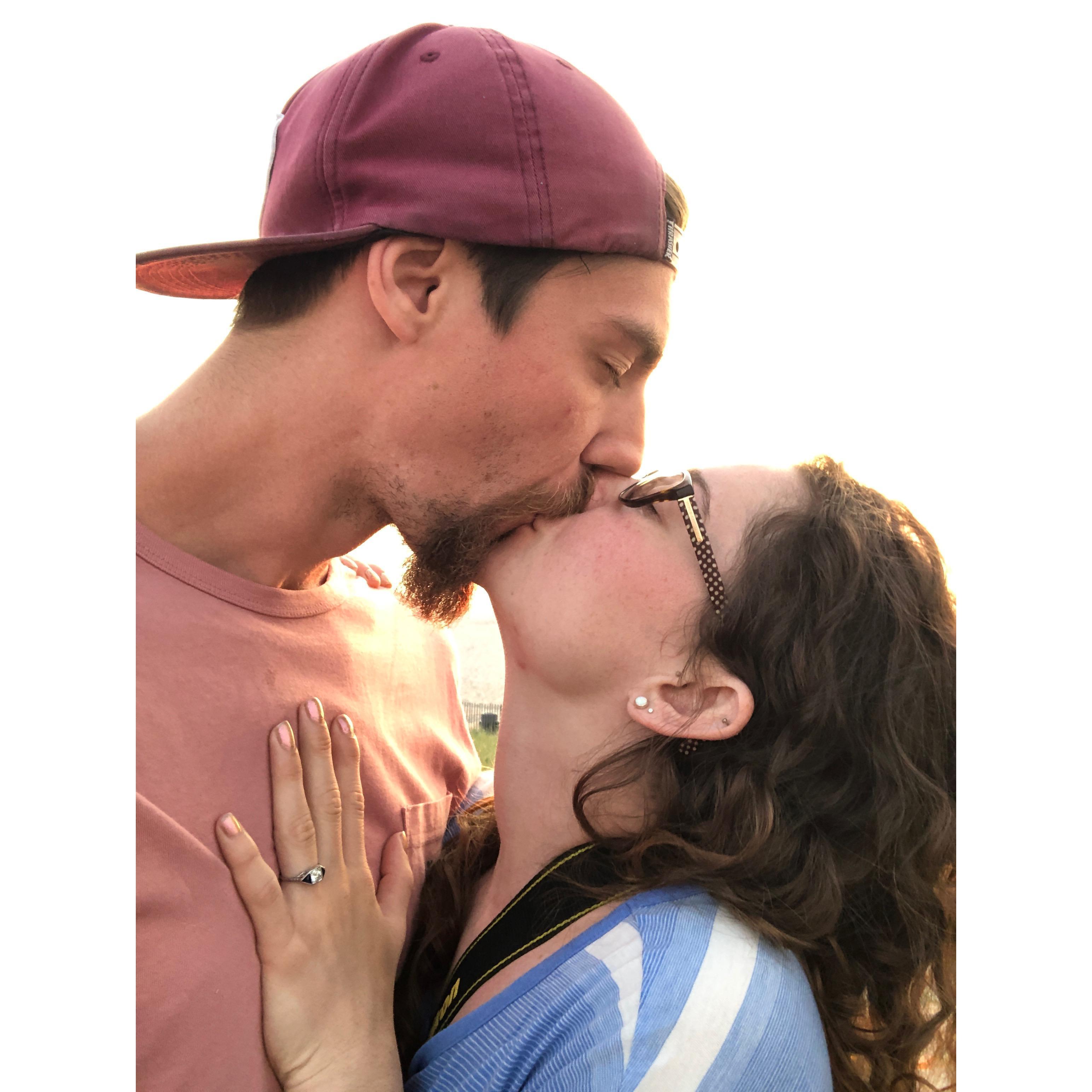 A kiss on the beach at sunrise right after Matt popped the question.