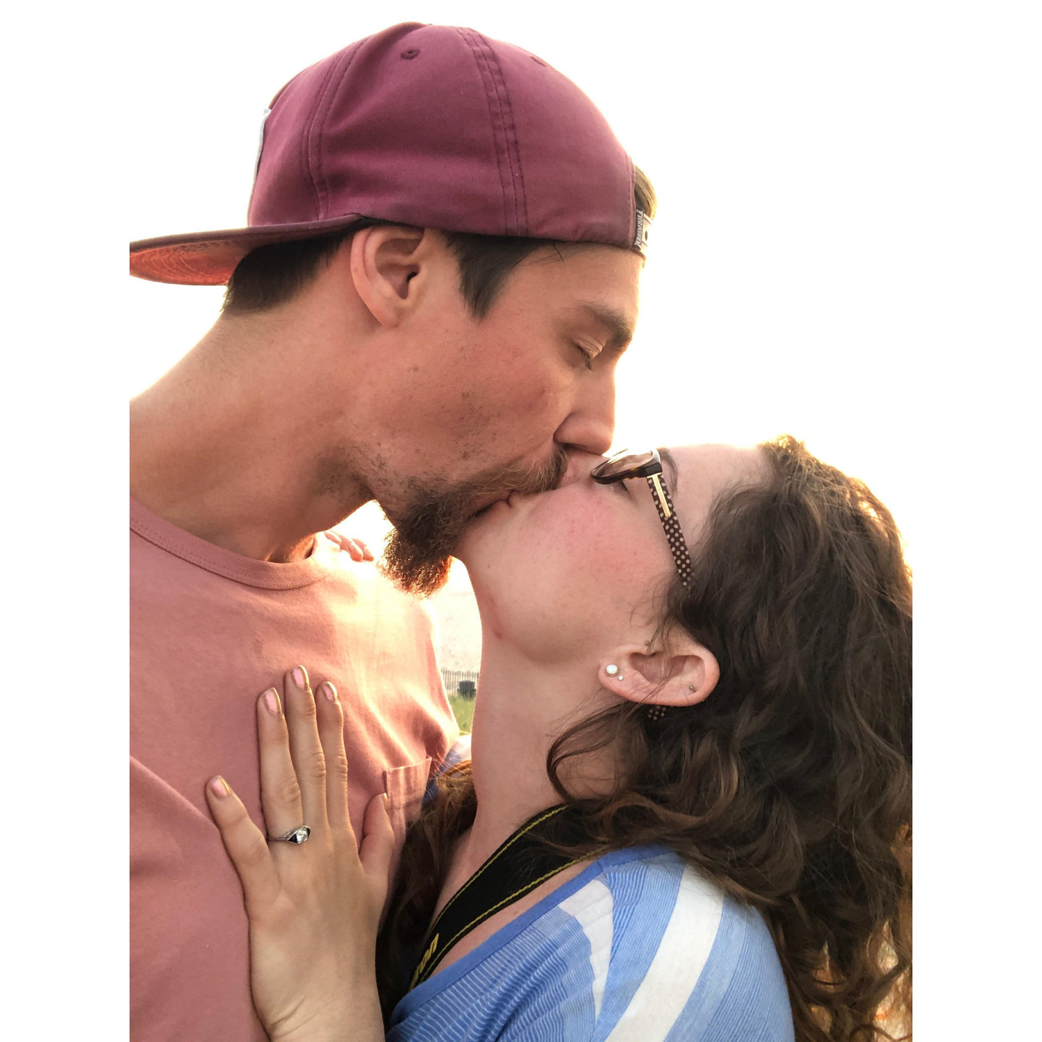 A kiss on the beach at sunrise right after Matt popped the question.