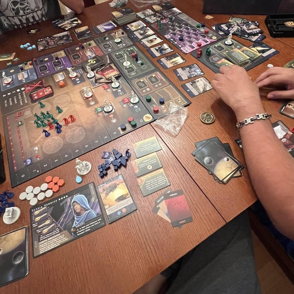 We are huge board gamers, so I had to include us playing our favorite board game ever- Dune Imperium. We even named our cat after this game🤣