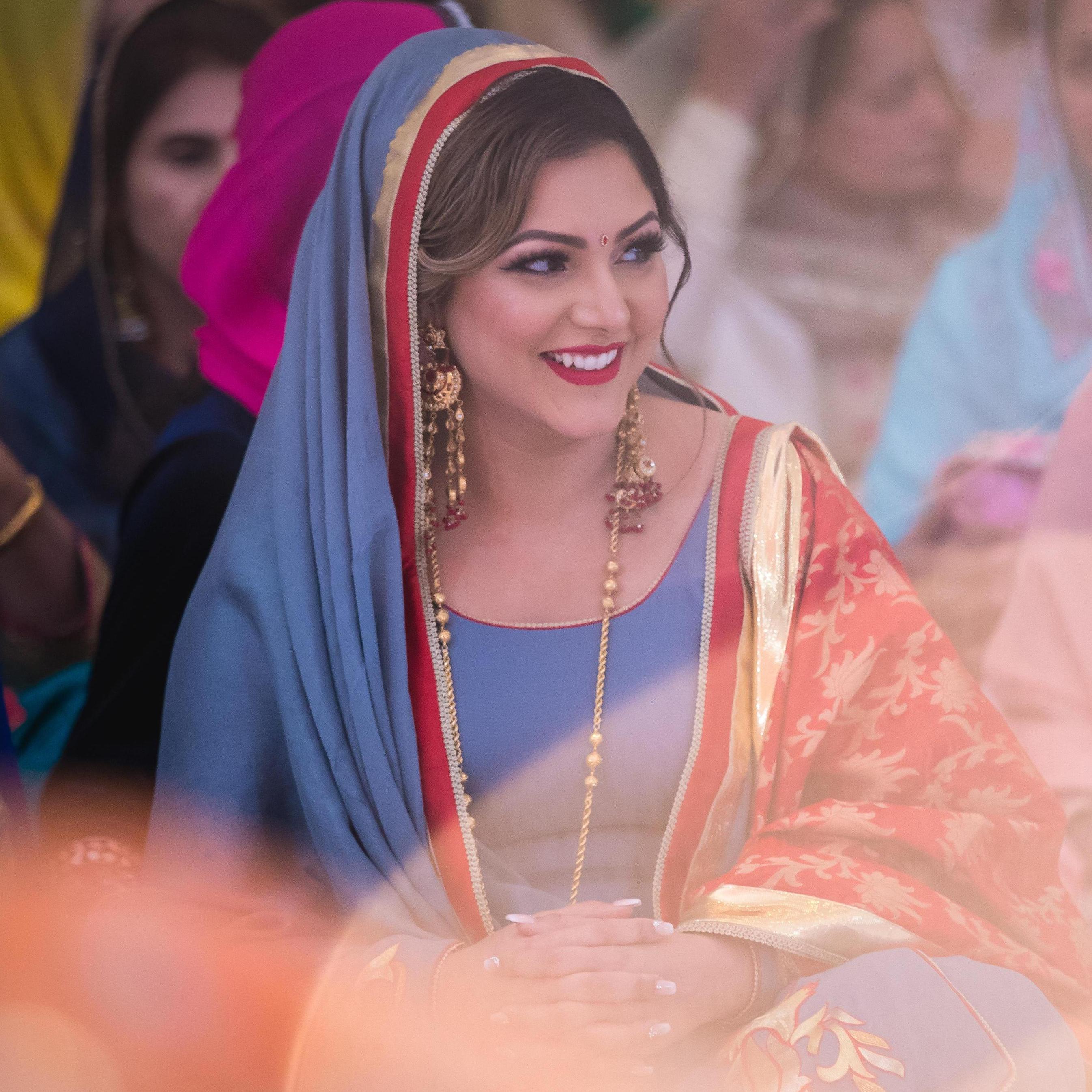 Laughing at something Karnbir said to preet from across the room.