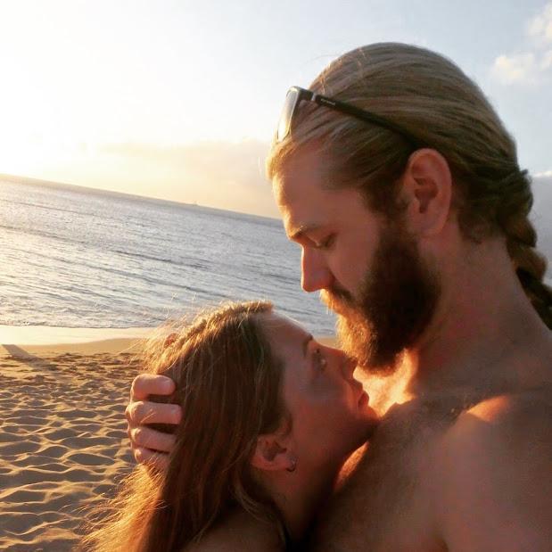In Hawaii, having a romantic moment.