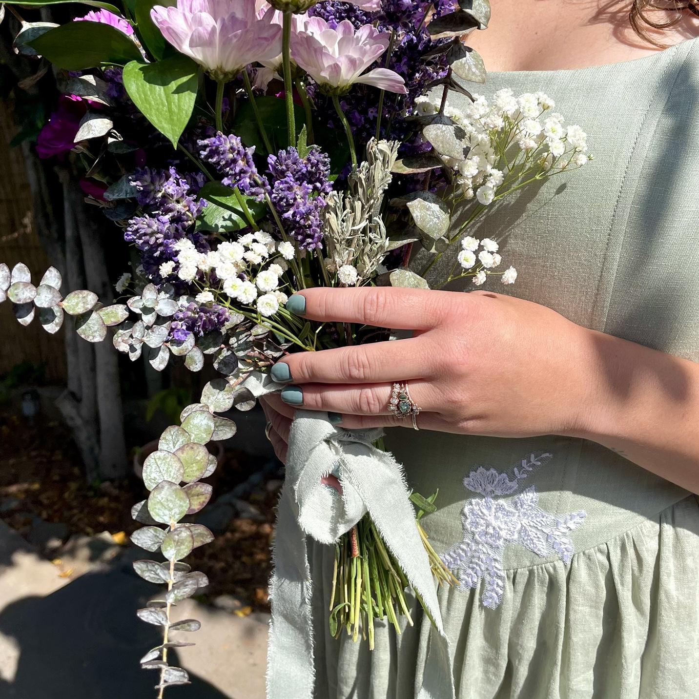 Julia made her bouquet from grocery store flowers and lavender picked from her yard. The sprig of sage is from Wyoming.