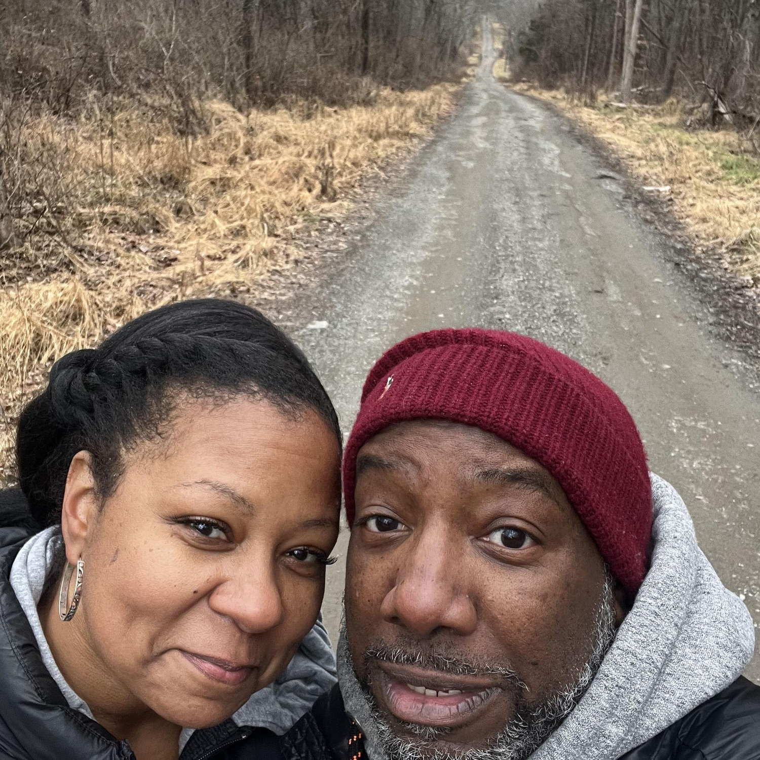 Jan 1st, 2024. Greg looks terrified. This was fun! We went on a walk/hike! Look at the hill behind us!