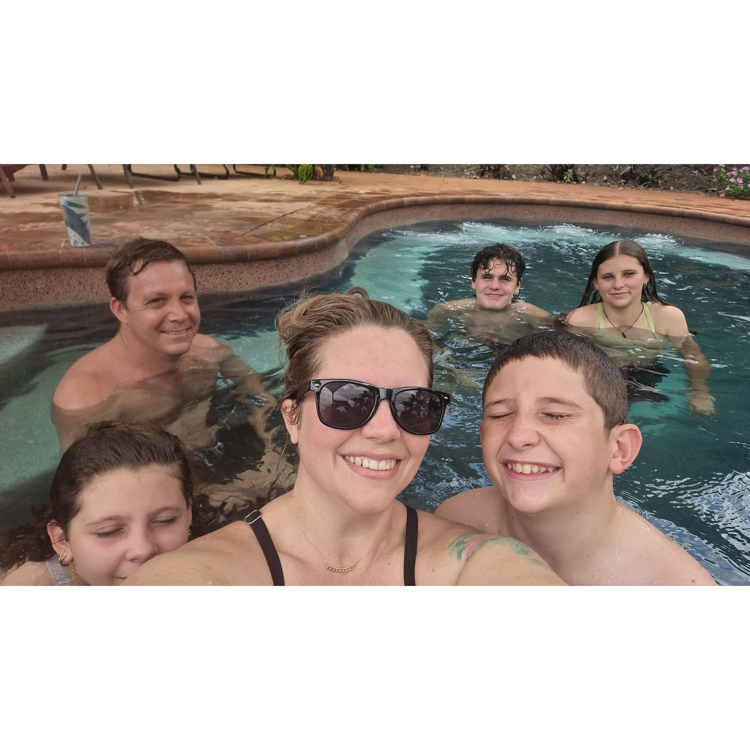 Family swims in the backyard pool, Howard Springs NT