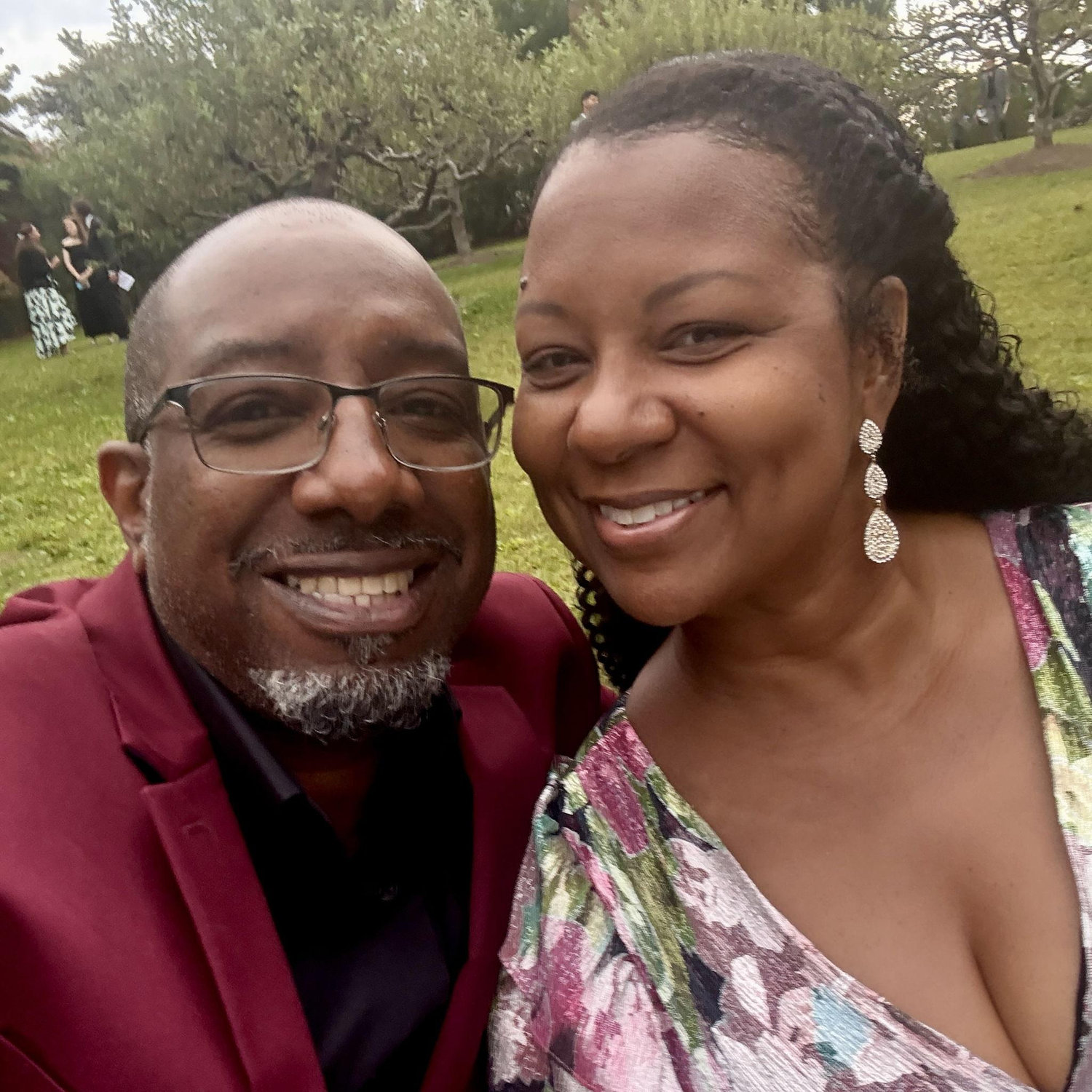 Attendees at a beautiful outdoor wedding celebration.