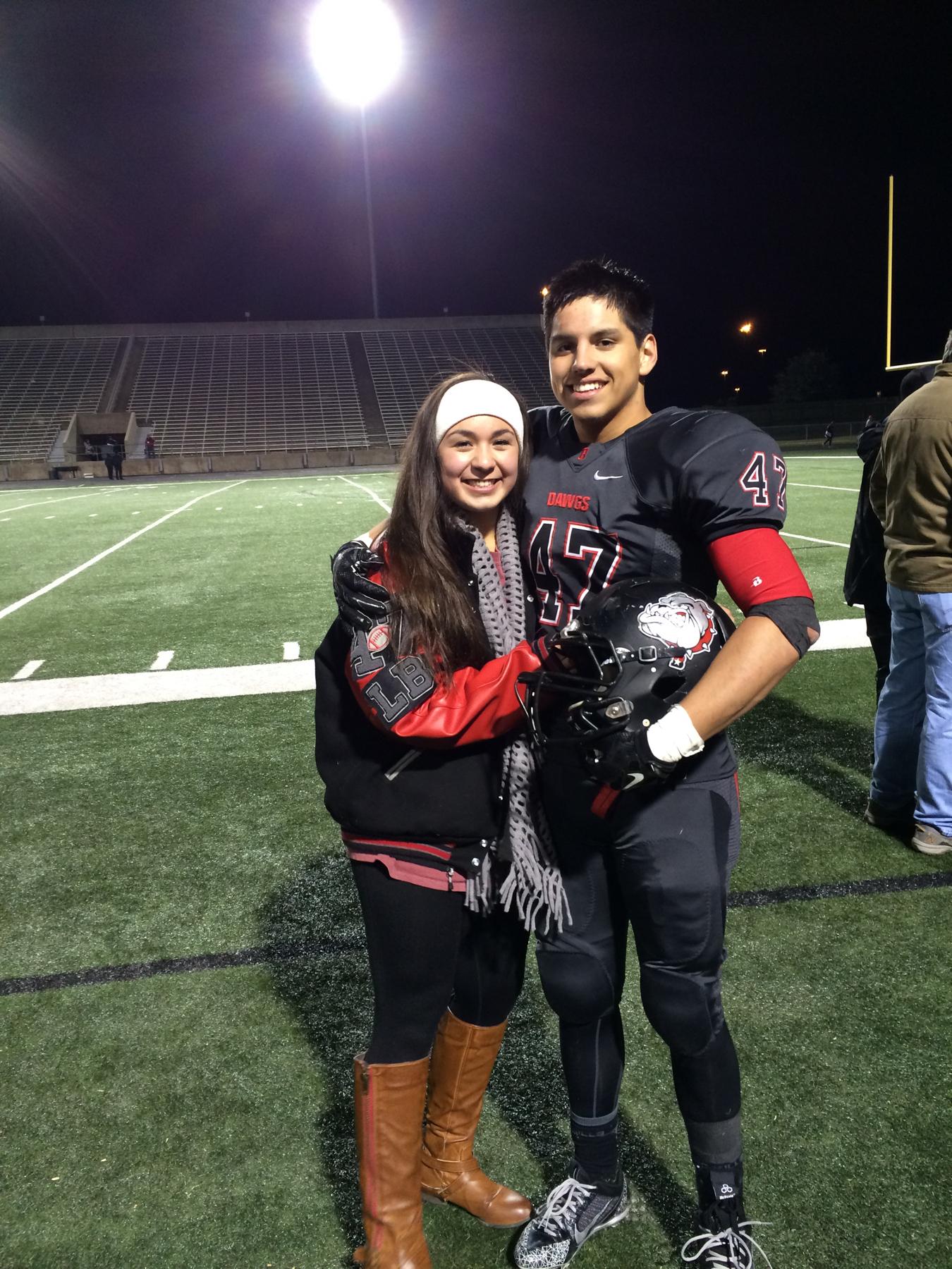 Senior year of high school. Cruz was defensive player of the year! #47. Cristina wearing his letterman jacket.
2014