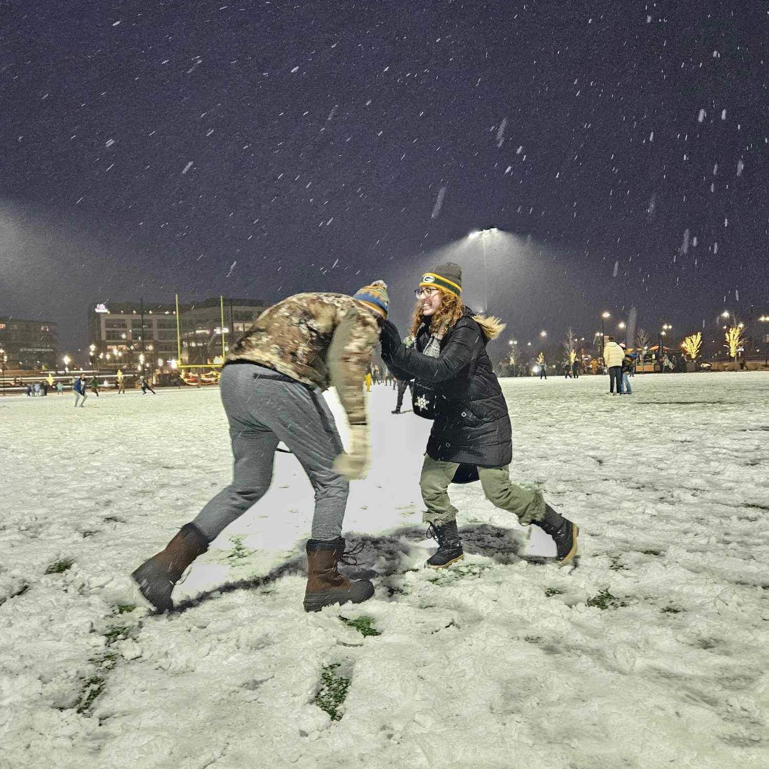 Playing in the snow at Titletown before a Packers game