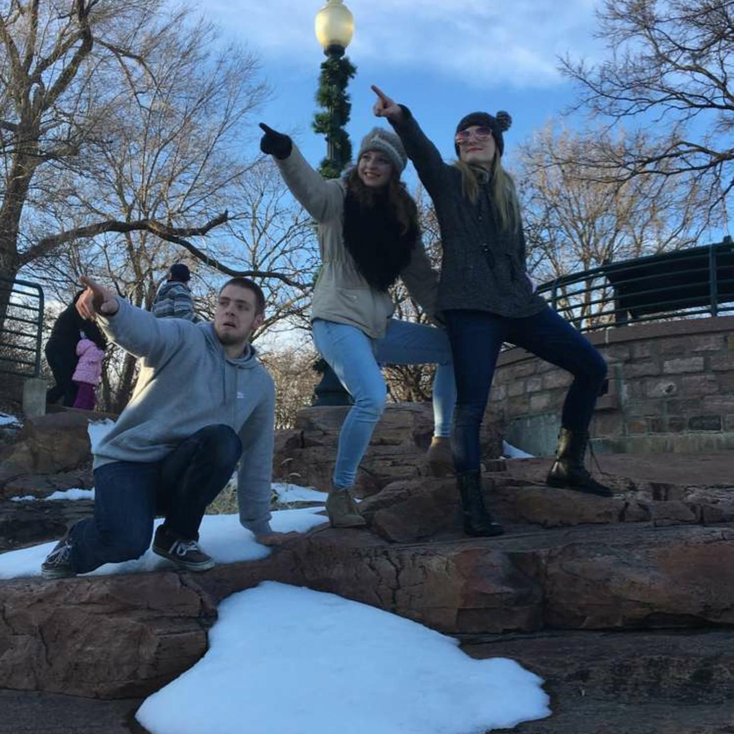 Cheyenne, Kim, and Robert posing for a picture at the falls