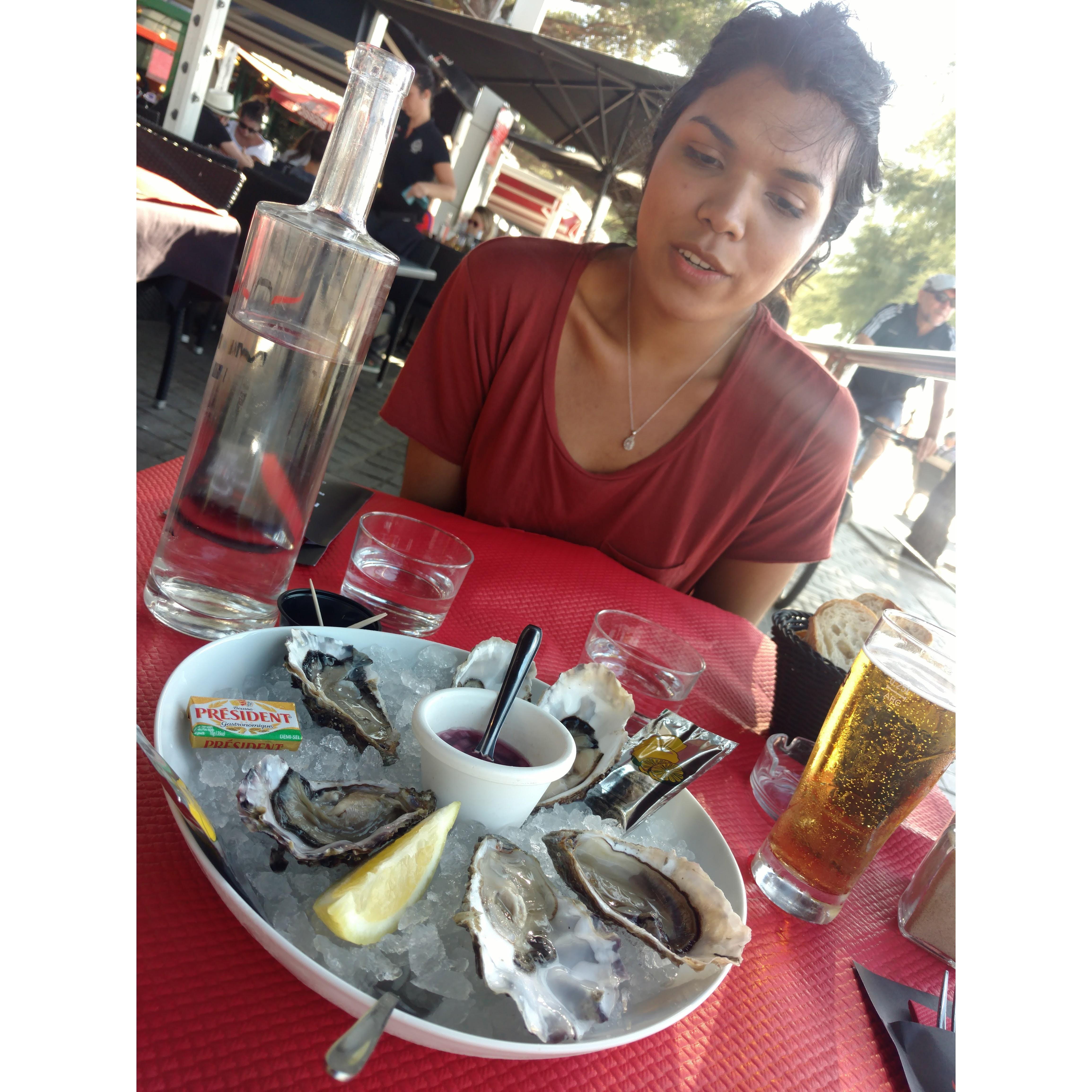 July 2017. Johan and Jess take a trip to the beach in Annecy, France. Jess is excited to show Johan how to eat oysters.