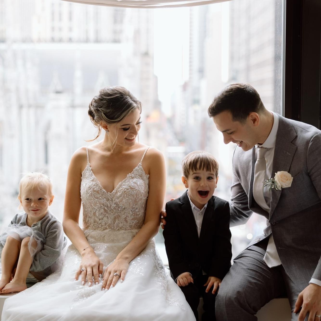 My niece, the flower girl, and my nephew, the ring bearer, with Johnny and me right after the ceremony.