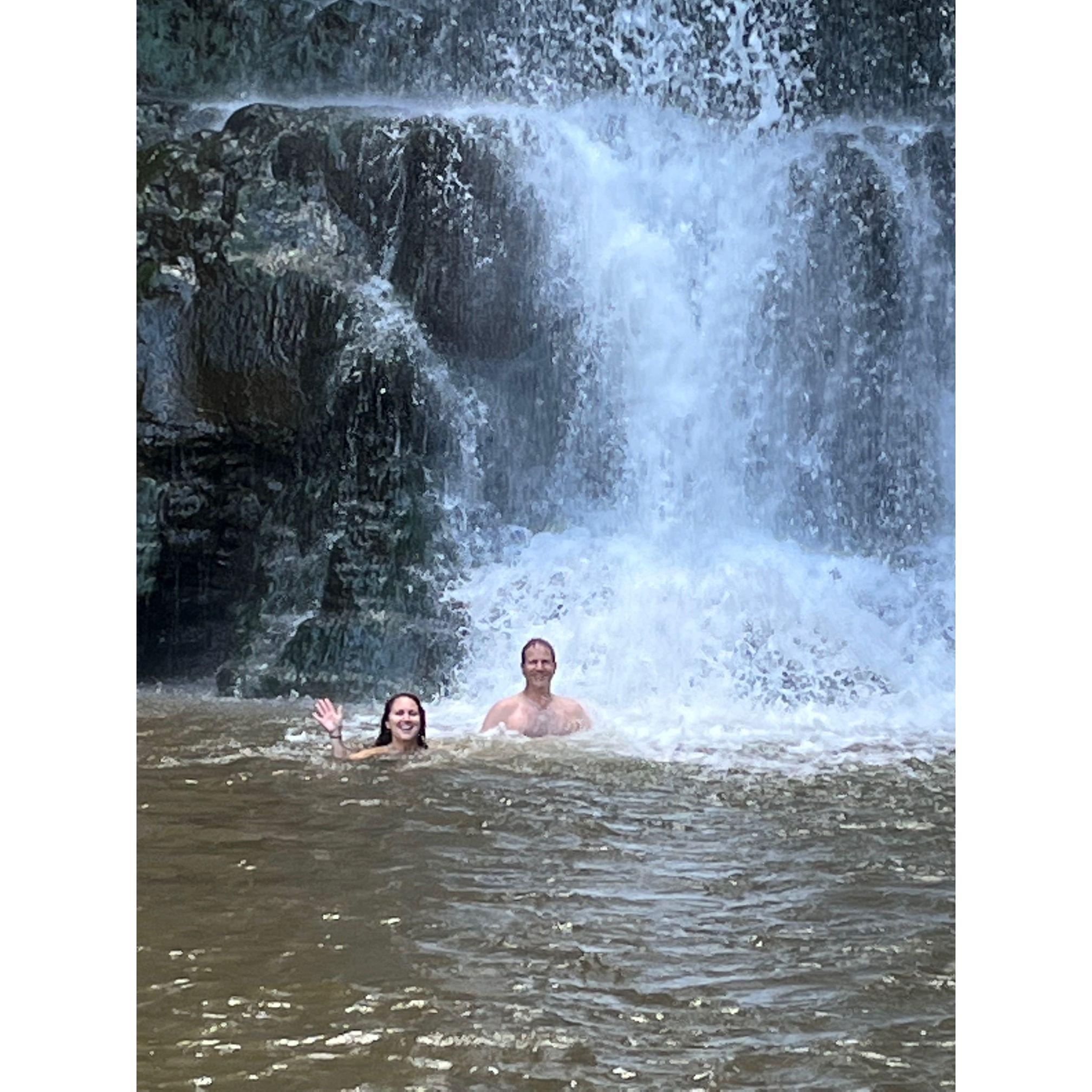 Swimming in the waterfall in Hawaii.