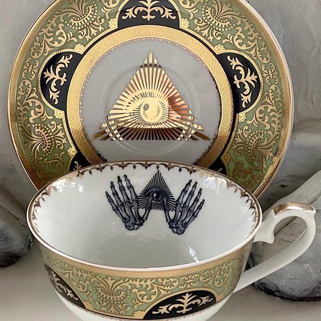 Green, Black and Gold allSeeing Eye and Skeleton Hands Teacup and Saucer Set, 8 Ounces. Food- and Dishwasher Safe.