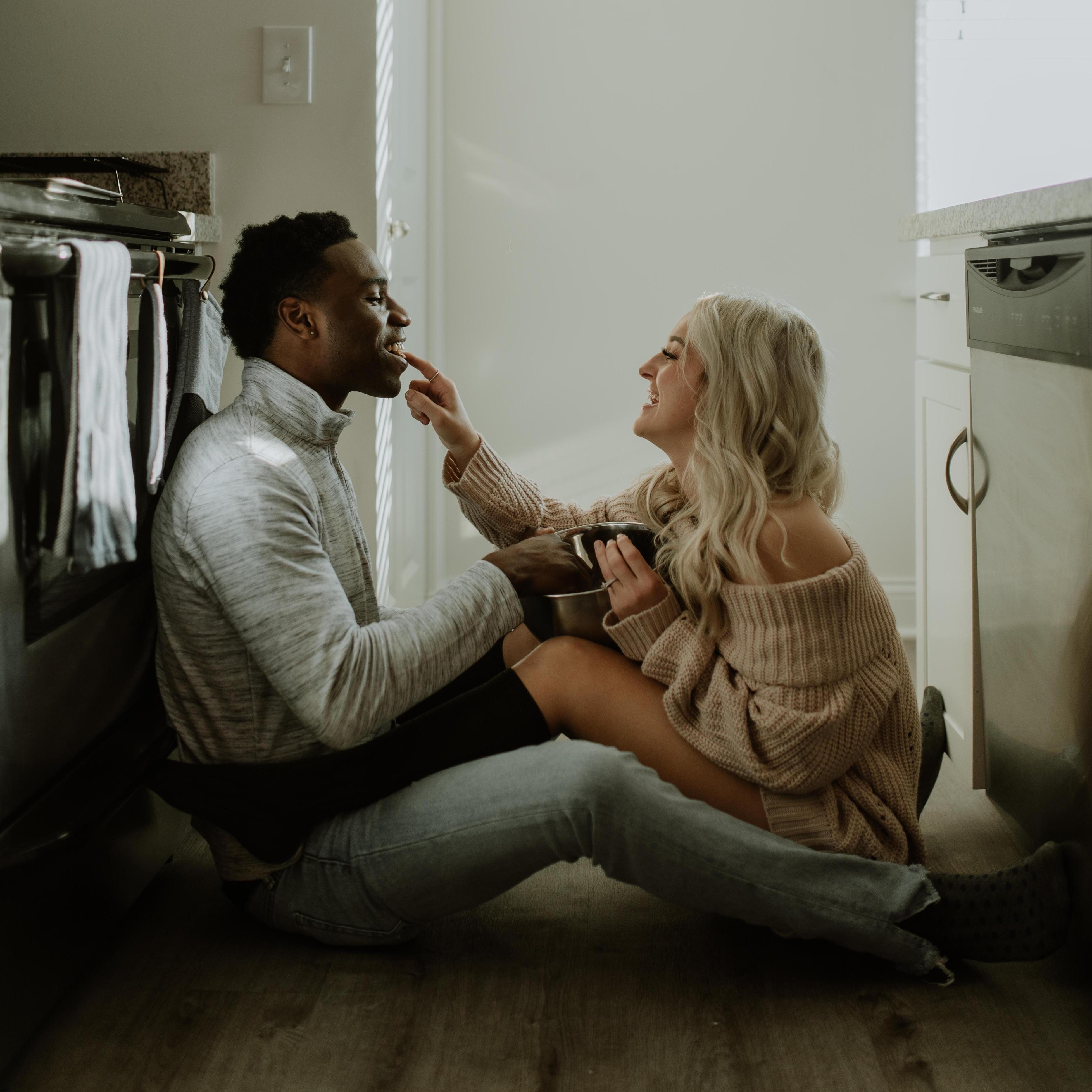 At home engagement shoot enjoying chocolate chip cookie dough