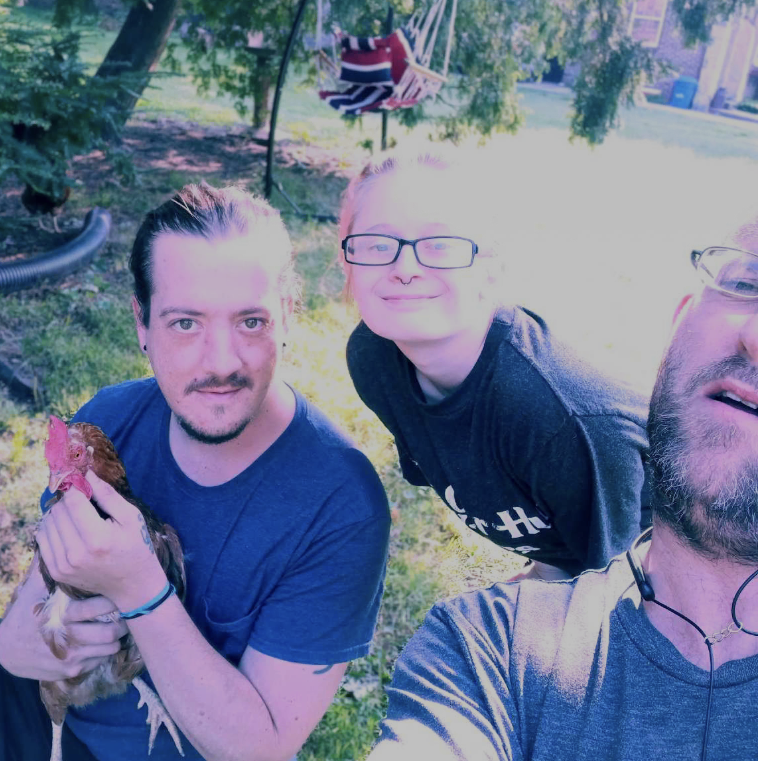 Visiting Heathers' moms' house, Heather had Jared catch the chicken so she could pet it, Justin took a photo.