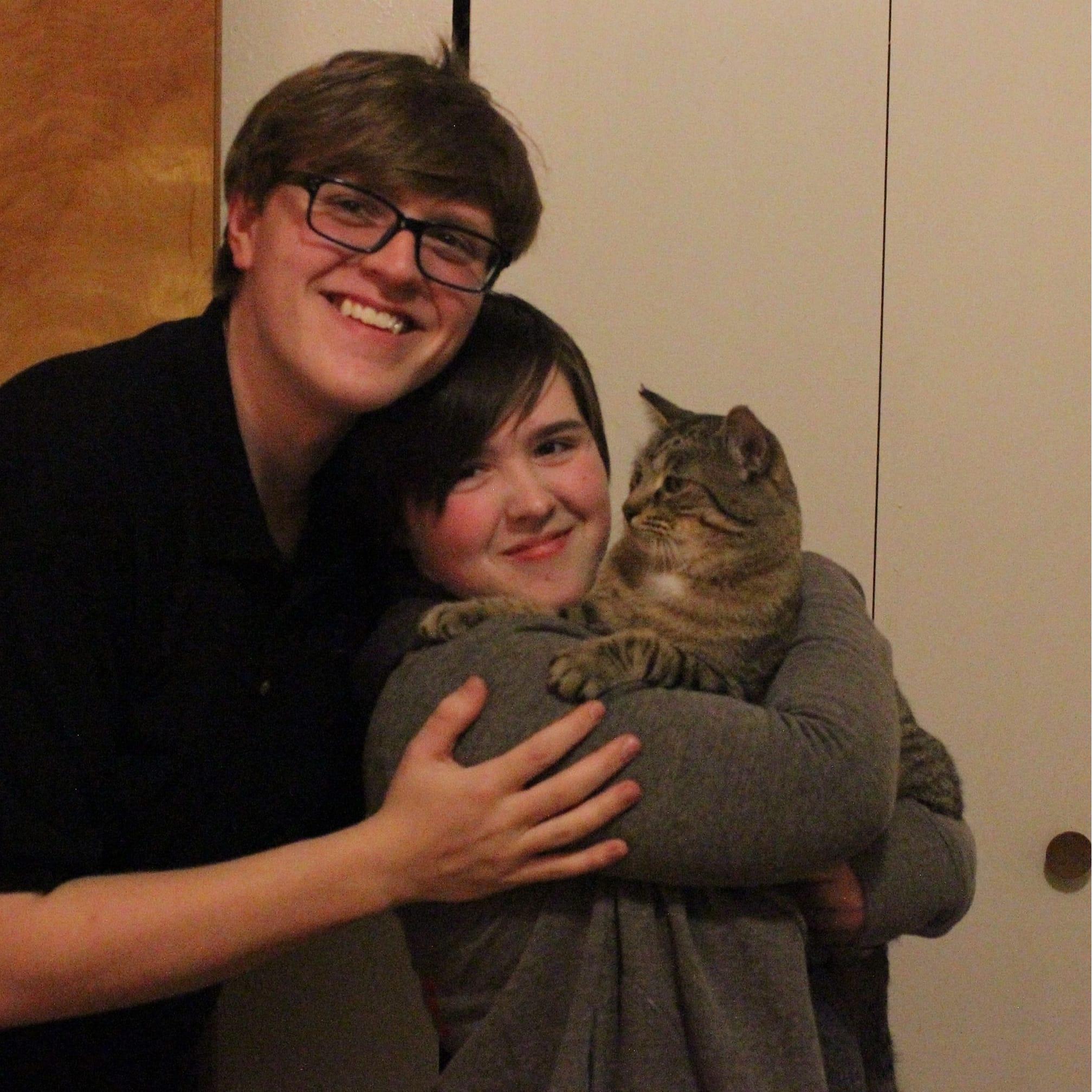 Our little family in our first apartment. From left to right - > Dean, Lily, Max