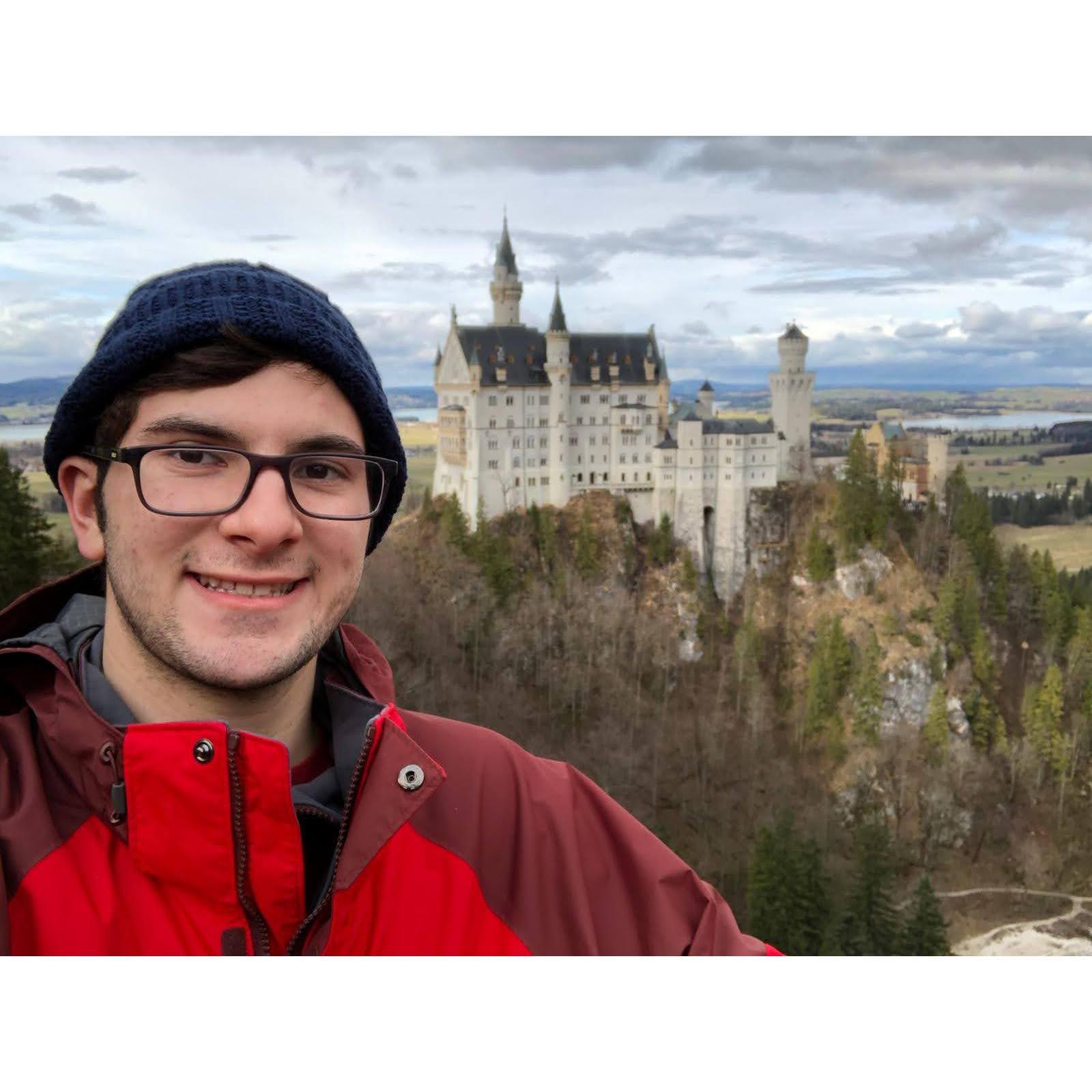 Matt when he was traveling in Germany, the castle in the background is the Neuschwanstein castle.