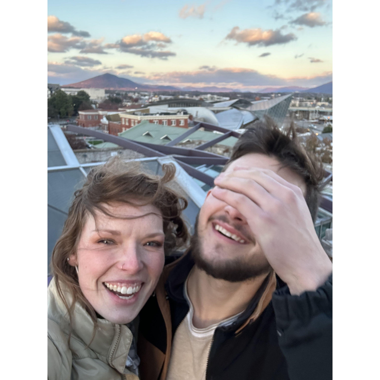 Trying to take pictures right before Logan proposed!