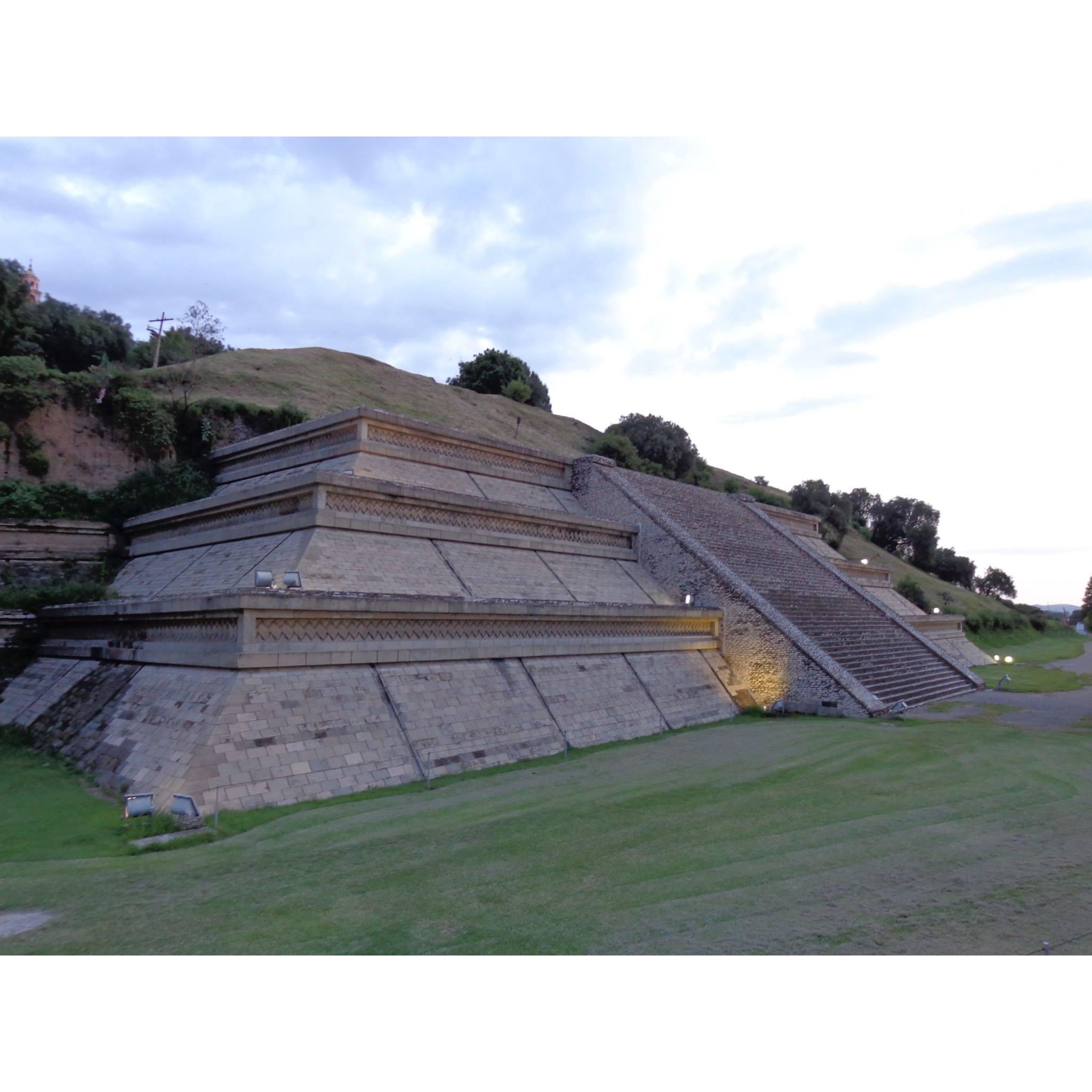 The base of La Gran Piramide de Cholula or Tlachihualtepetl, the world's largest pyramid. There are a series of tunnels visitors can explore!