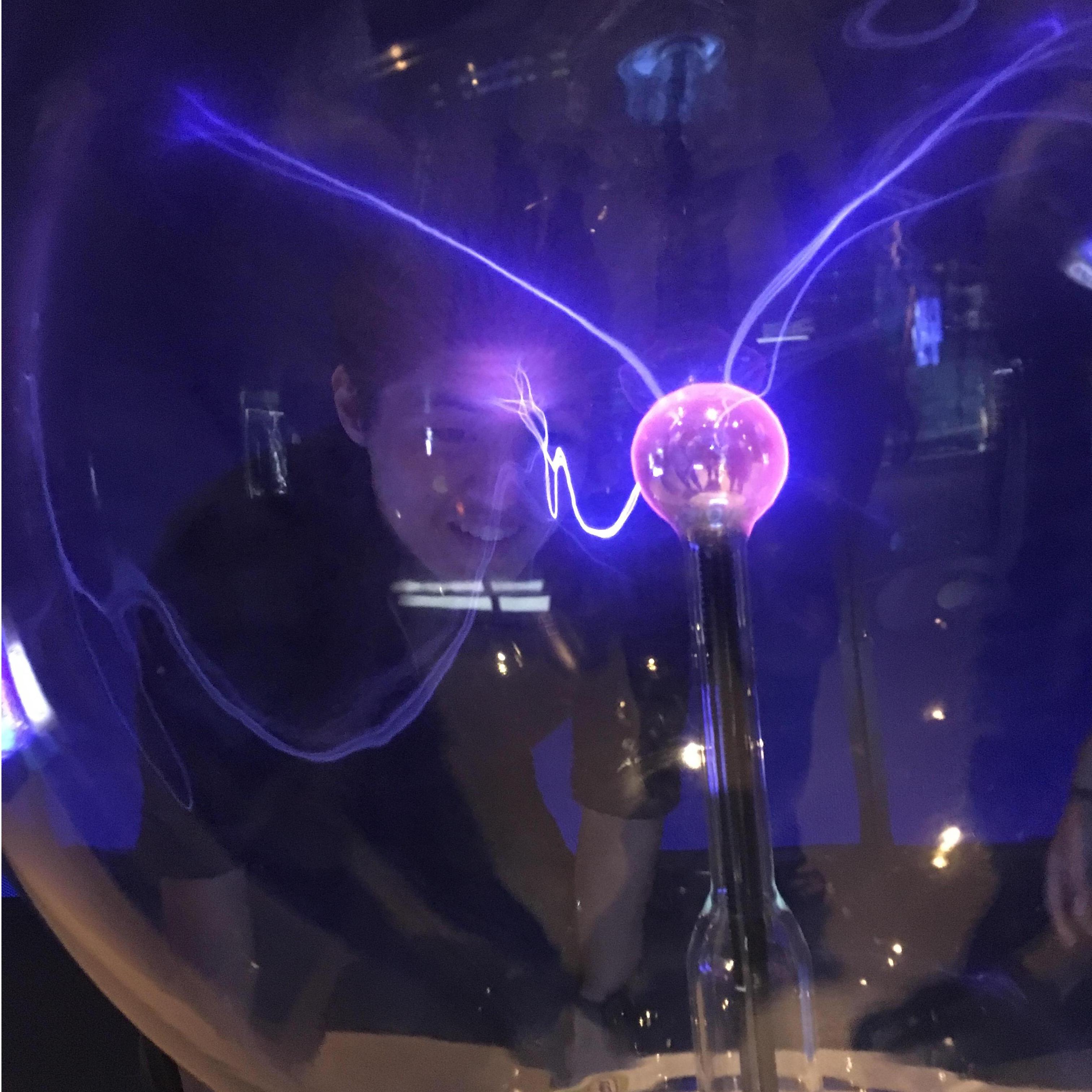 Yong visits Elizabeth's favorite museum - MSI in Chicago. Yong is being goofy with the plasma ball. (08/2018, Chicago, IL)