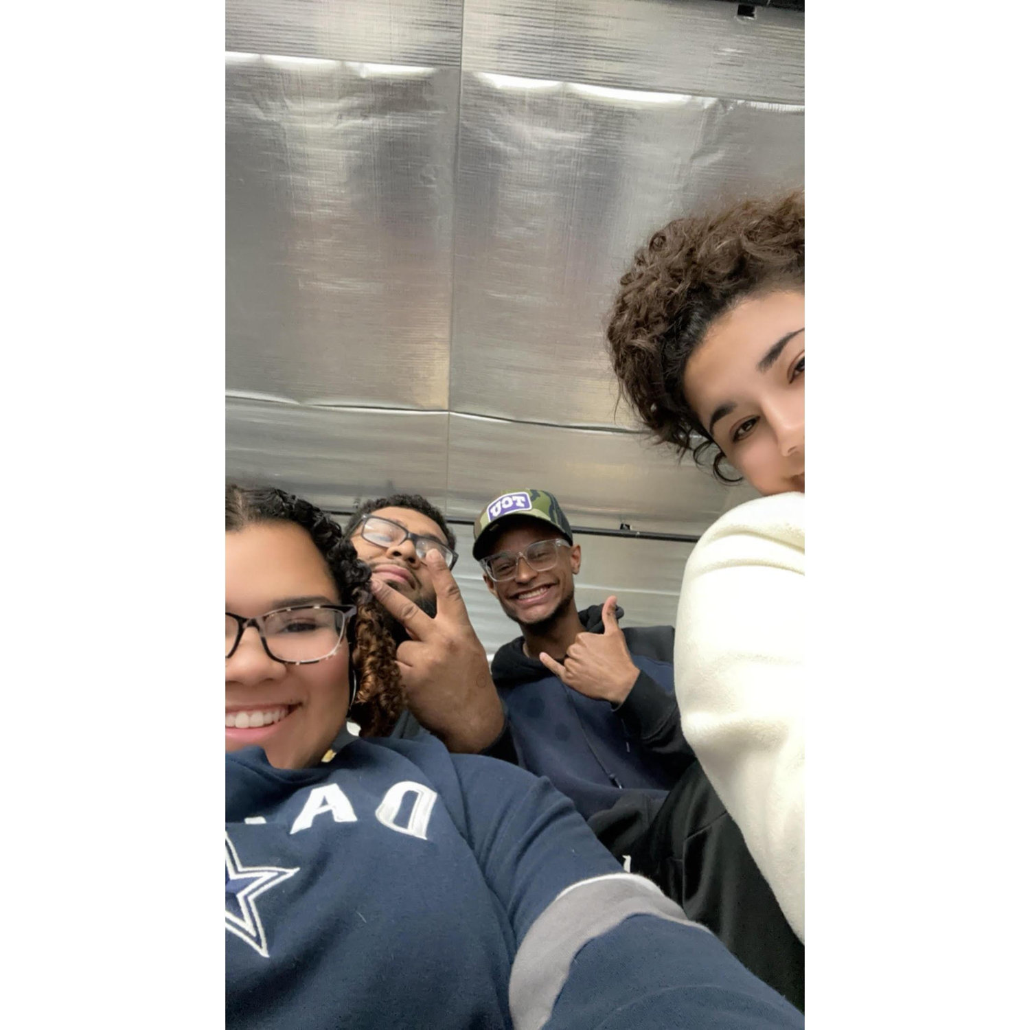 "Us with our friends at a hockey game." - Alex & Alexis
