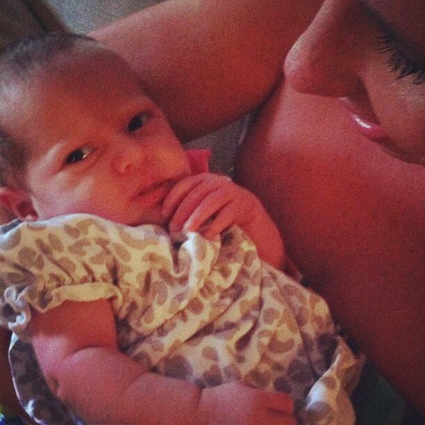 Holding newborn Evelynn (our Flower Girl) for the first time.