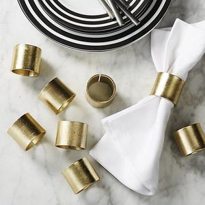 set of 8 scott gold napkin rings.