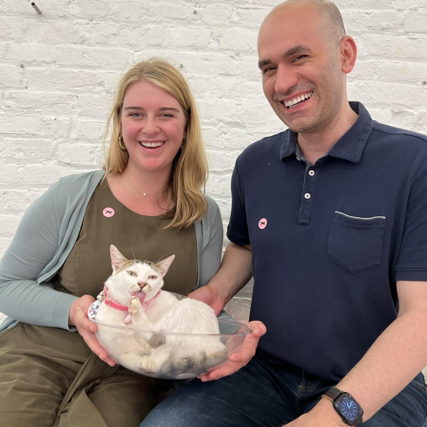 Habib brought Ruth to a cat cafe while living in DC. Everyone was just passing this cat in a bowl around!