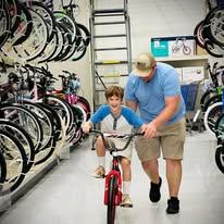 In June of 2023, Aaron helped teach Evan how to ride a bike and bought him his first one.