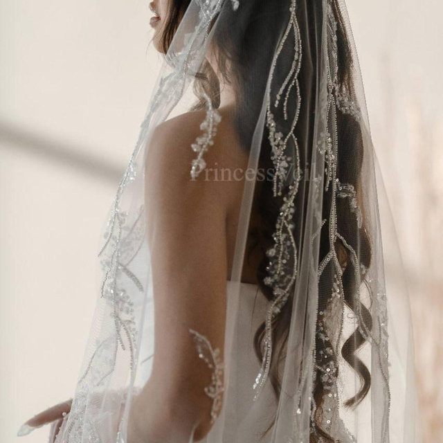 Modern veil with lace silver trim with embroidery, from the comb and the bottom of the veil. This single layer