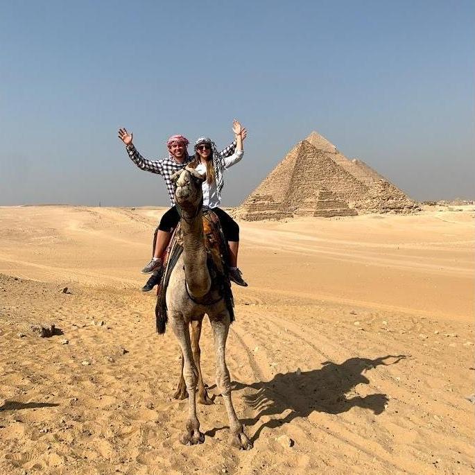 Riding a camel around the pyramids on our trip to Egypt