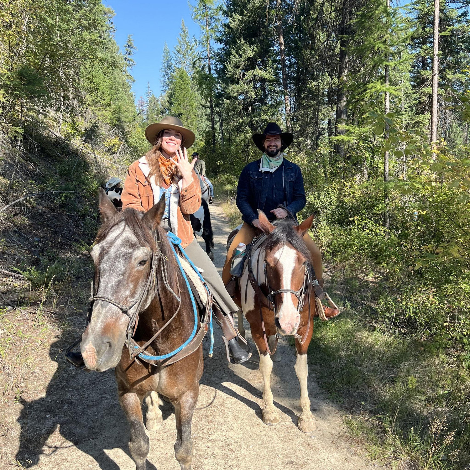Horseback riding together after getting engaged in Montana