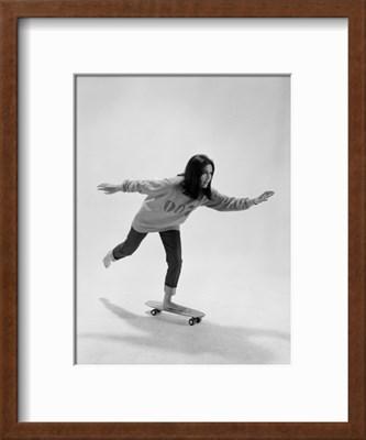 1965 Photographic Print of Gloria Steinem Riding a Skateboard with a 007 James Bond Sweatshirt