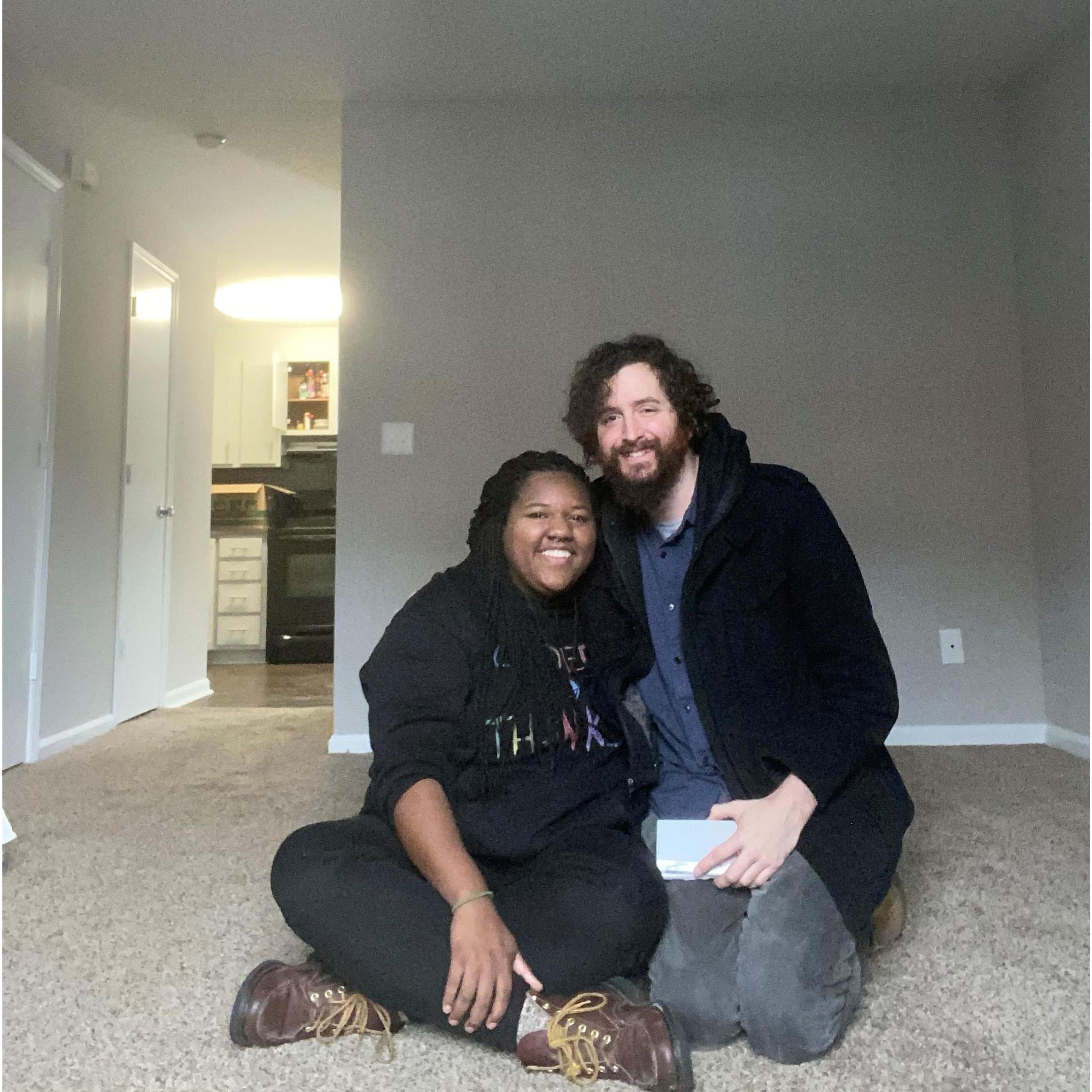 Obligatory "first apartment together" picture. We were very tired. But here is a tip, always hire movers!