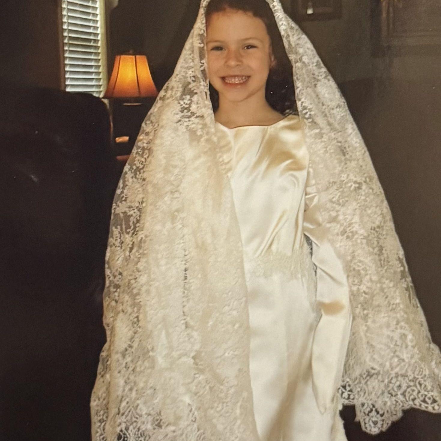 Rachel playing dress up in a wedding dress