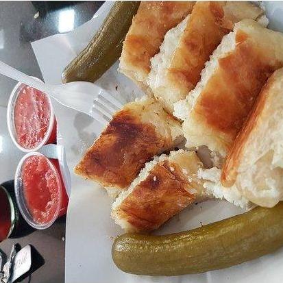 Bourekas Haagala - "Big Bourekas" - Phyllo dough filled with cheese and served with grated tomato sauce.