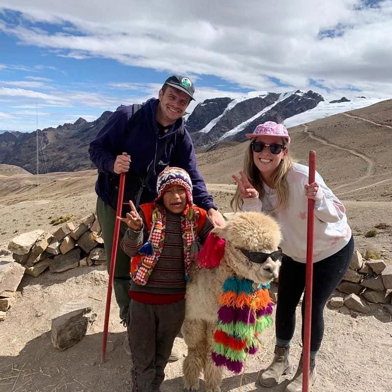 Rainbow mountain with an alpaca in sunglasses!