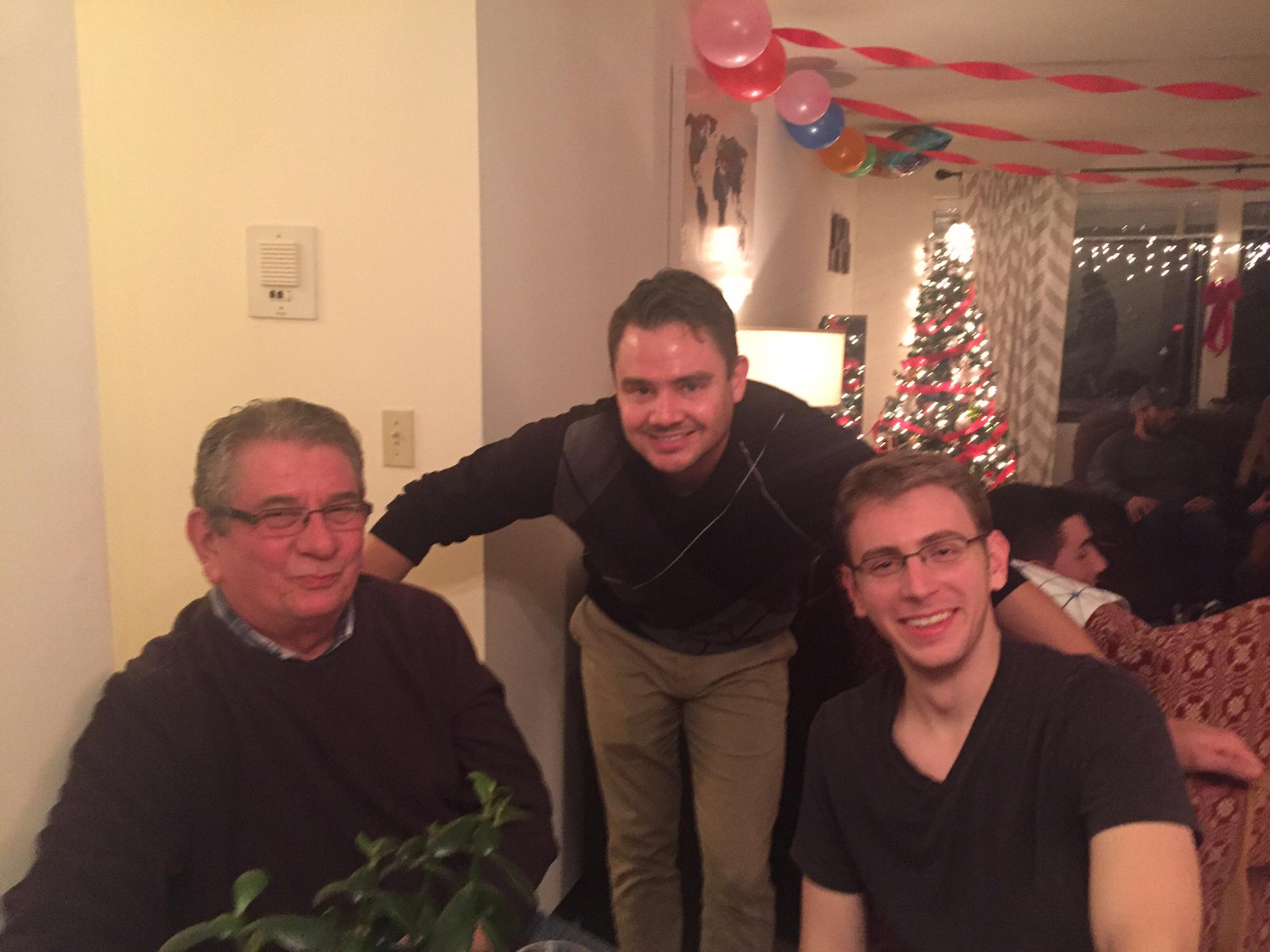 Best man Ryan Govoni with the groom and groom's father, Brian, at Evan’s surprise birthday party.