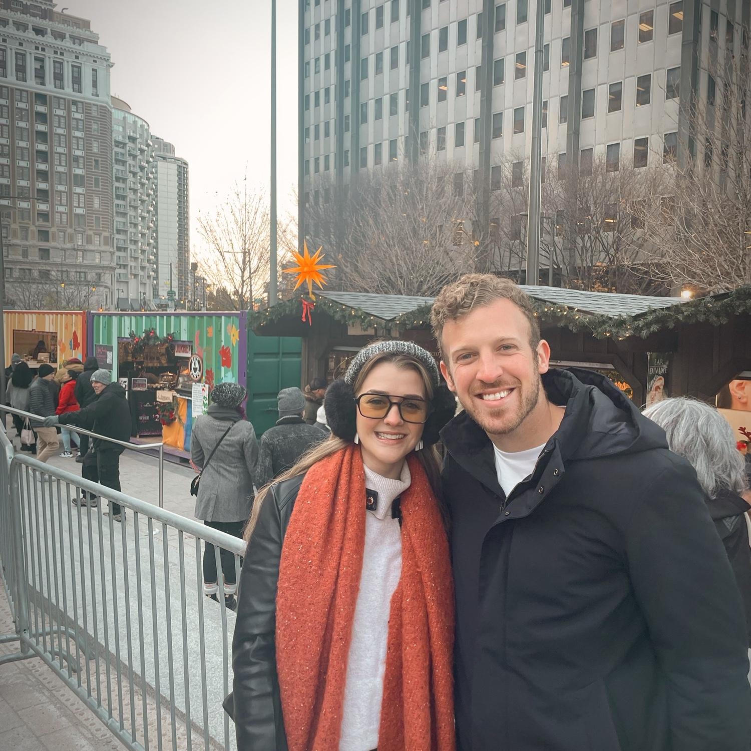 Trying delicious foods at Philly's Christmas market.