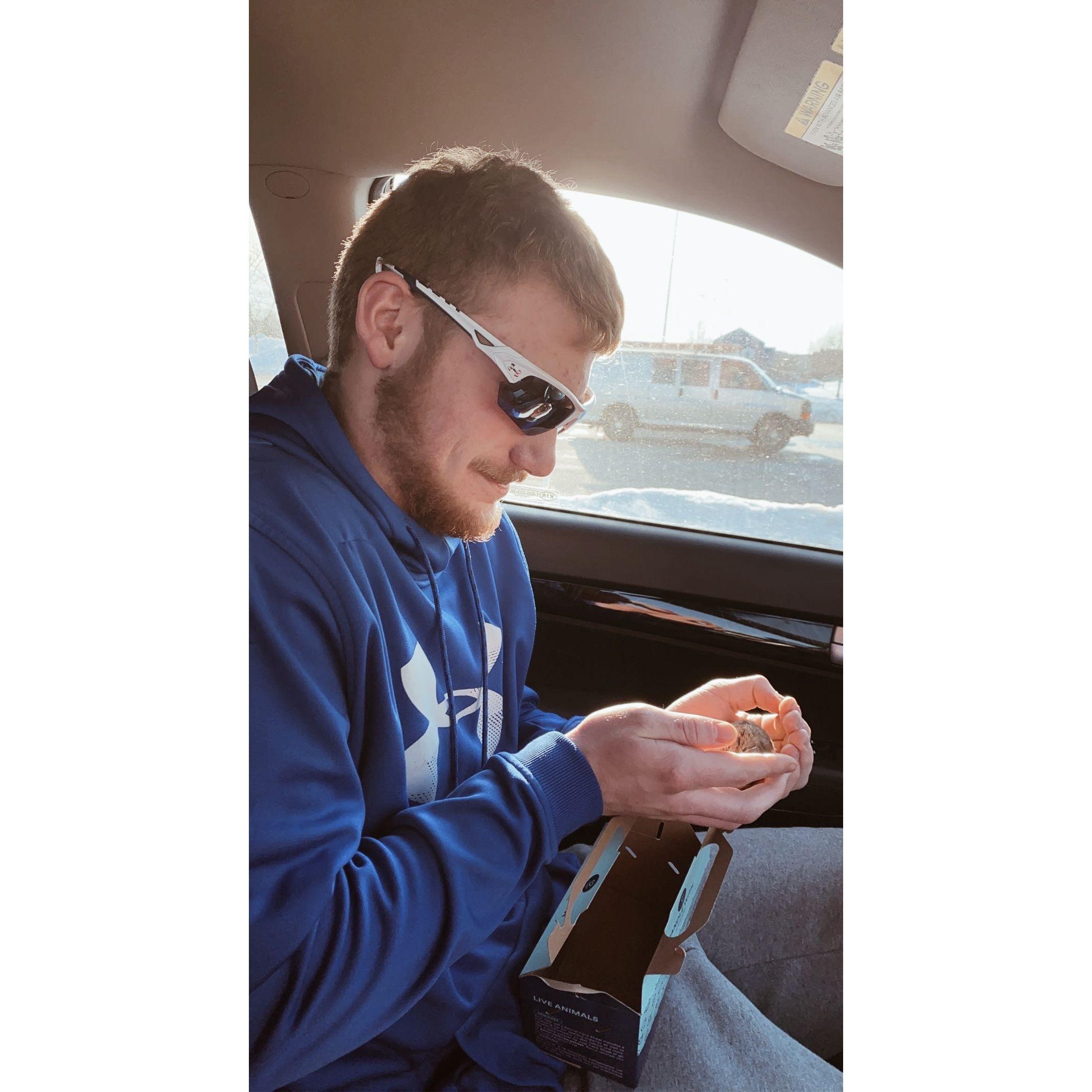 Walker holding my favorite pet Butterball the hamster right after we got her