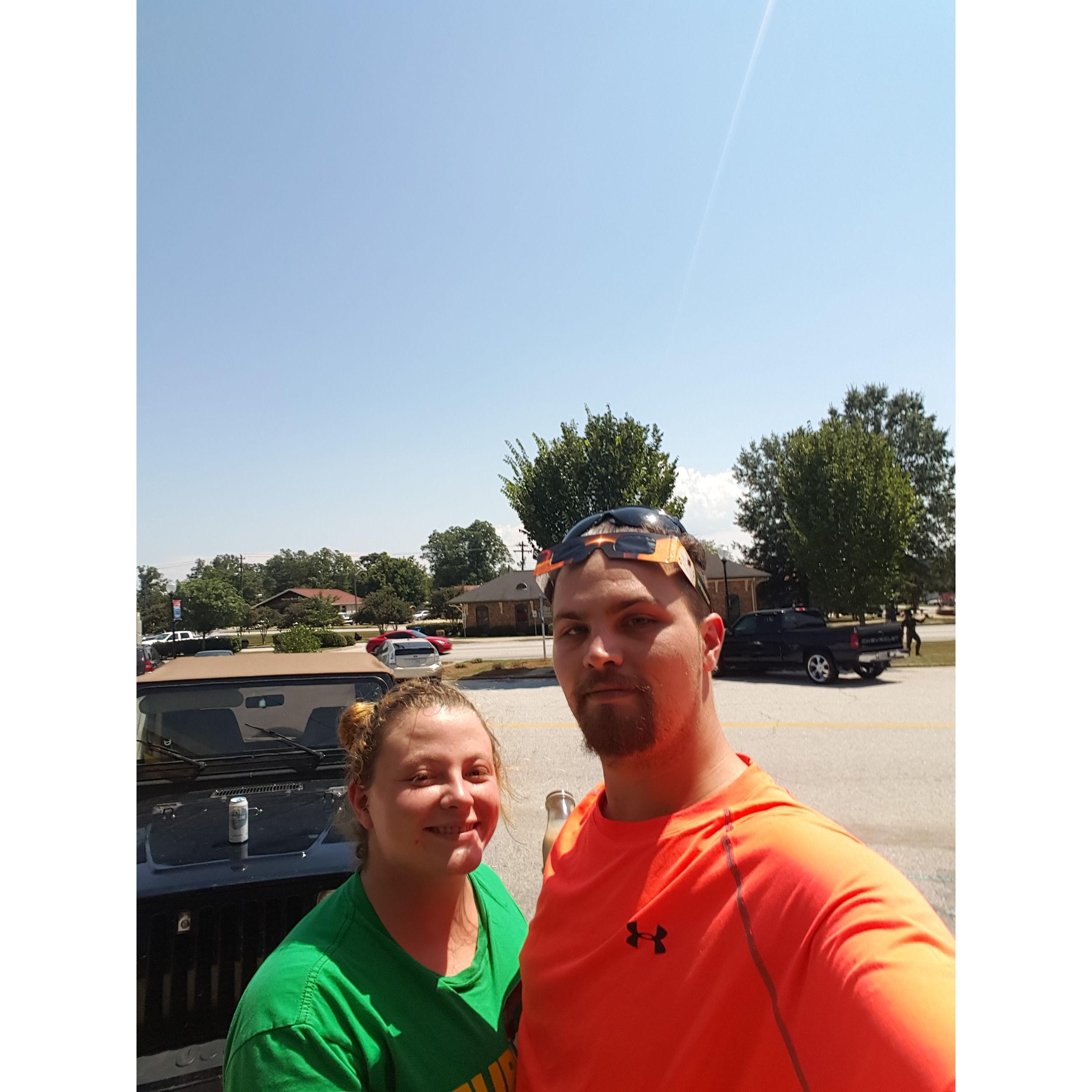 Watching the solar eclipse in the parking lot of the Subway we met at