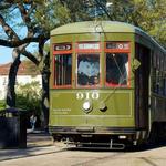Take the street cars down Saint Charles Avenue
