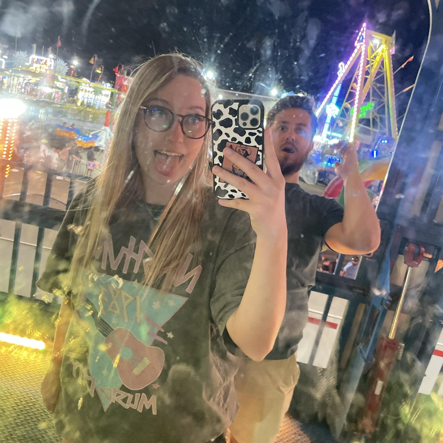 A glimpse into how unserious Christopher and Kaitlin are, but at a carnival
