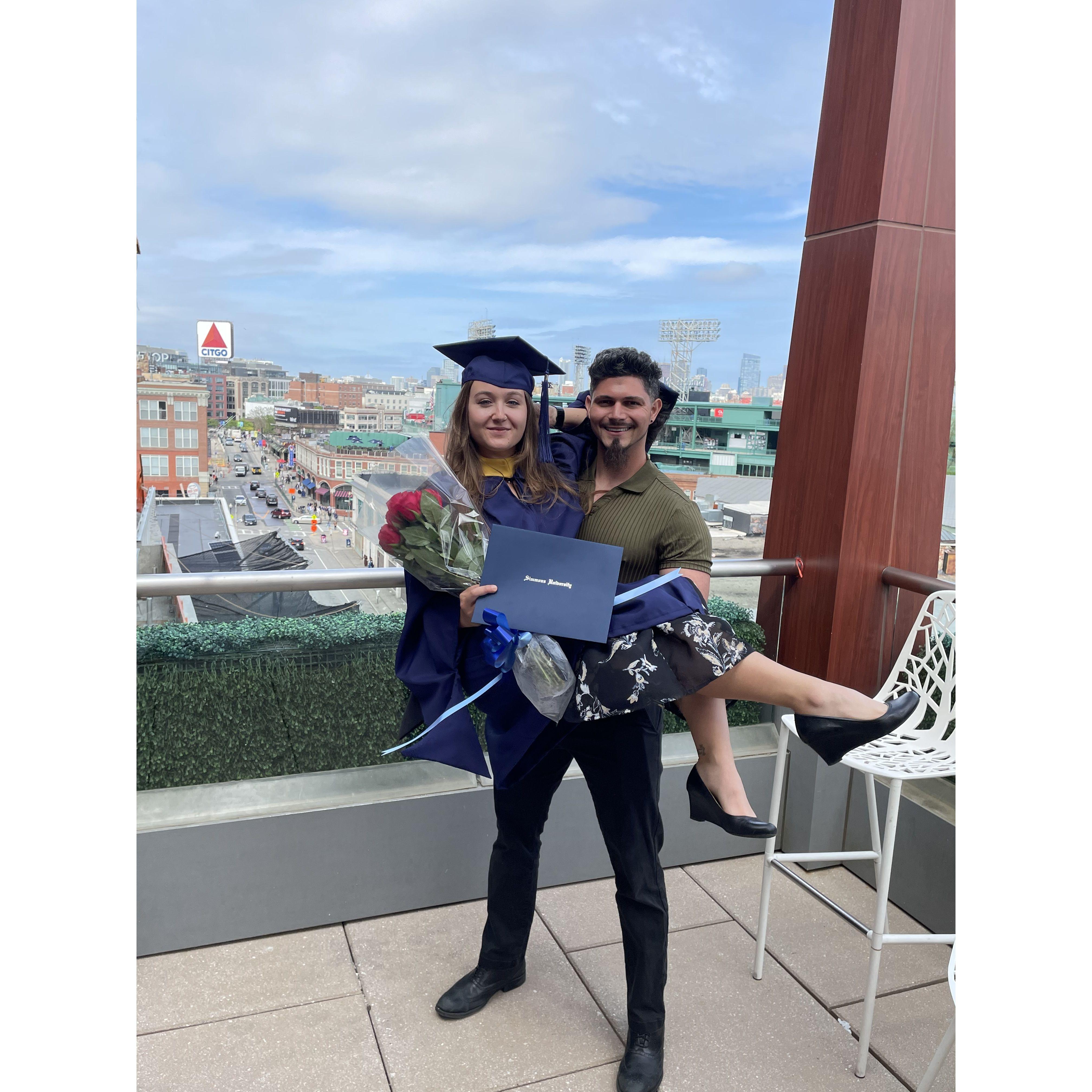 Celebrating Mary's MSW in Boston overlooking Fenway's iconic Citgo Sign