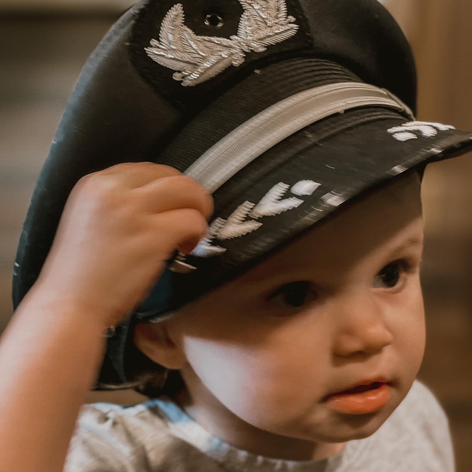 Introducing the first ever baby captain! Wearing daddy’s hat!